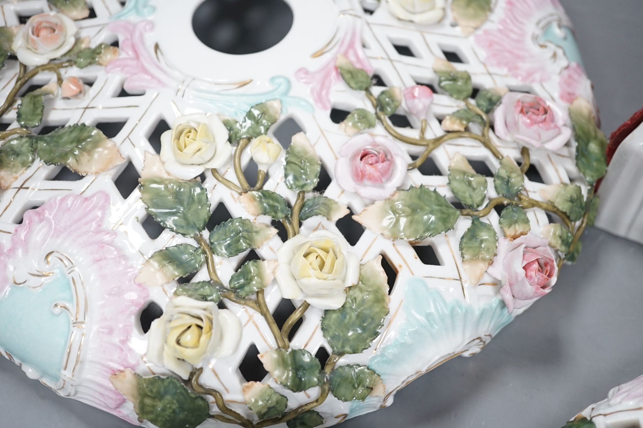 Two Sitzendorf porcelain ceiling shades, a similar wall bracket and a Dresden white glazed wall bracket, shades 30cm diameter